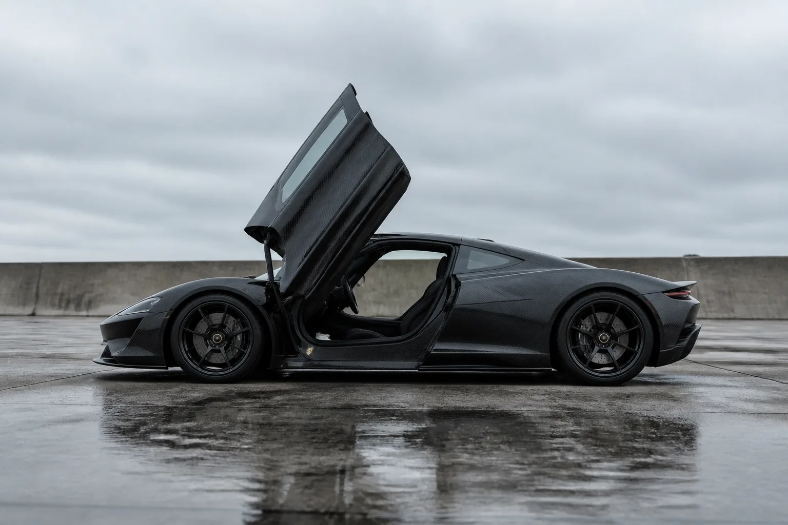 A hypercar with a dihedral door rotated up and forward